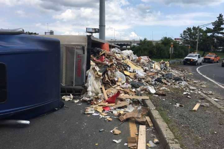 GARBAGE IN, GARBAGE OUT: Trash Truck Overturns In Elizabeth Monday