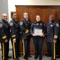 <p>Officer Niamh McGuinness receives her life-saving award from Bergen County Sheriff Anthony Cureton and his command staff.</p>