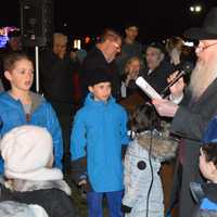 <p>Children sang during the menorah lighting ceremony in Wayne on Tuesday.</p>