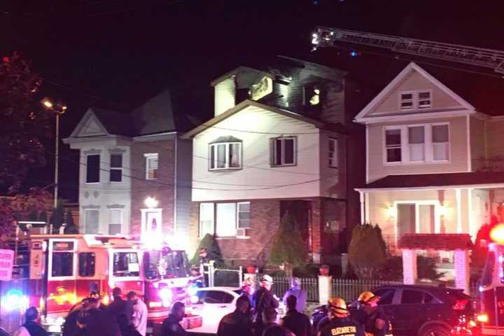 WATCH: Elizabeth Firefighters Battle Blaze In Home's Top Floor