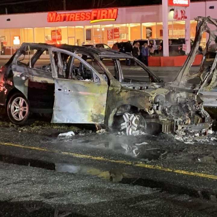 A Long Island man was saved from a burning vehicle by two police officers.