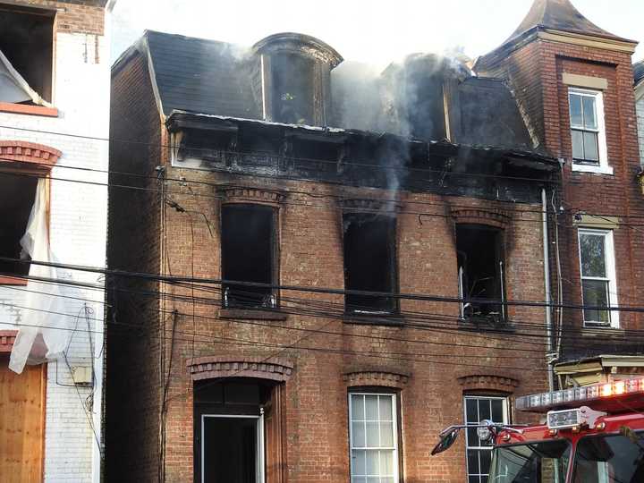 City of Newburgh police rescued a man stranded on the roof a burning building and another was rescued from inside.