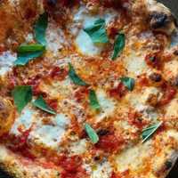 <p>Tomato sauce, fresh mozz, basil, sea salt, olive oil: A pizza pie from Razza Pizza Artigianale.</p>