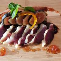 <p>House Cured Duck Prosciutto. Fig Two Ways, Fig-Port Tapenade and Ripe Fig. Candied Orange Zest. Toast. Fig-White Balsamic Gastrique.</p>