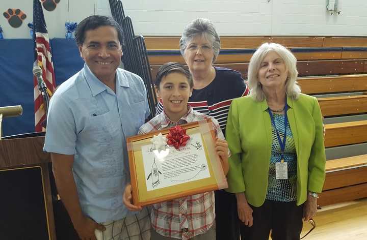 Charlie Garcia with his award.