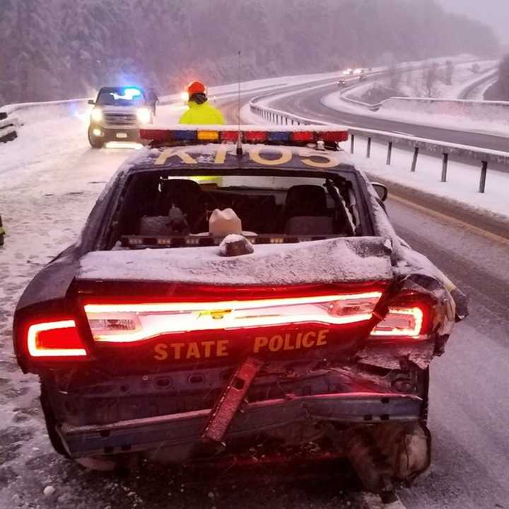 A New York State trooper escaped injury after his vehicle was rear-ended.