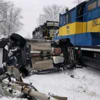 <p>A young woman escaped serious after her vehicle was hit by a train. Photo by Warwick Fire Department.</p>