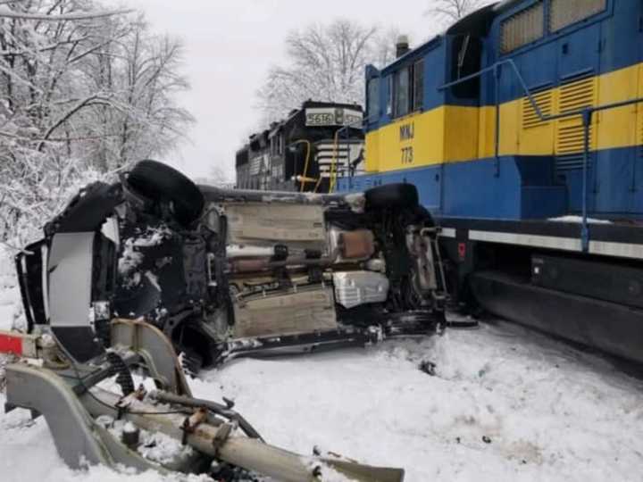 A young woman escaped serious after her vehicle was hit by a train. Photo by Warwick Fire Department.