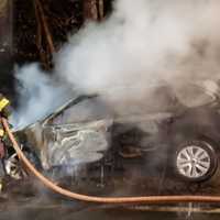 <p>A car burst into flames after the driver lost control and struck a utility pole.</p>