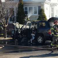 <p>Hawthorne firefighters doused flames that spread to a nearby house.</p>