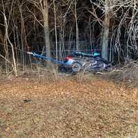 <p>Two people were trapped in a single-vehicle crash in Bedford.</p>