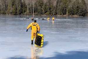 Firefighters Rescue Six From Pond After Falling Through Ice