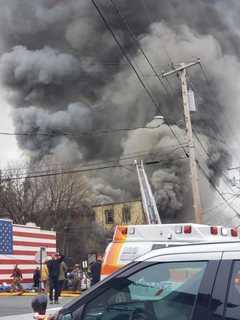 Four-Alarm Fire Breaks Out In Three-Story Building, Causing Road Closures In Area