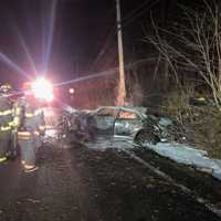 <p>First responders douse the flames.</p>