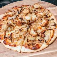 <p>French onion pizza from Cork &amp; Crust.</p>