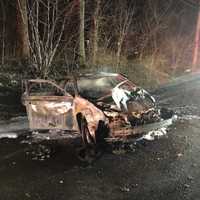 <p>A car was destroyed by fire following a crash.</p>