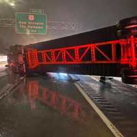 <p>The tractor-trailer blocked all three lanes of traffic on I-95.</p>