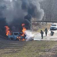 <p>A minivan burns in the Walmart parking lot in Newton.</p>