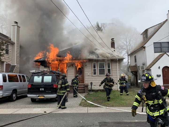 A man was forcibly removed from his home after setting it on fire and barricading all the doorways.