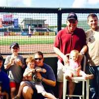 <p>Phil Tisi at the ballpark with his family.</p>