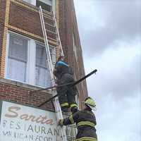 <p>Figueroa and DiBella bring the girl down safely during Monday&#x27;s fire in Passaic.</p>