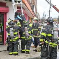 <p>Firefighters get the girl down safely.</p>