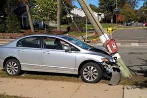 Sedan Topples Pole Outside Ridgewood School