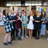 <p>Croton-Harmon High School’s AP Studio Art students, pictured here with teacher Jodi Burger, center, showcased their work during an art show in April.</p>