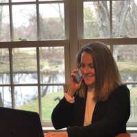 <p>Saxe Middle School&#x27;s Upper Division Nurse Sara Paine talks on the phone with a New Canaan resident.</p>