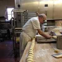 <p>A baker hard at work in Mazur&#x27;s Sugarflake Bakery. The landmark business will reopen on Ridge Road in Lyndhurst after being shuttered for 10 years.</p>