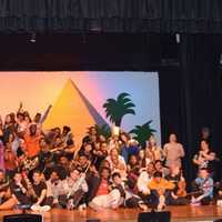 <p>The whole crew and cast of &quot;Aida&quot; get together on stage at Spring Valley High School.</p>