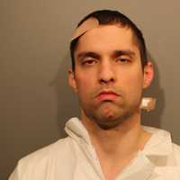 Neighbor Charged After Wilton Man Found Dead In Garage