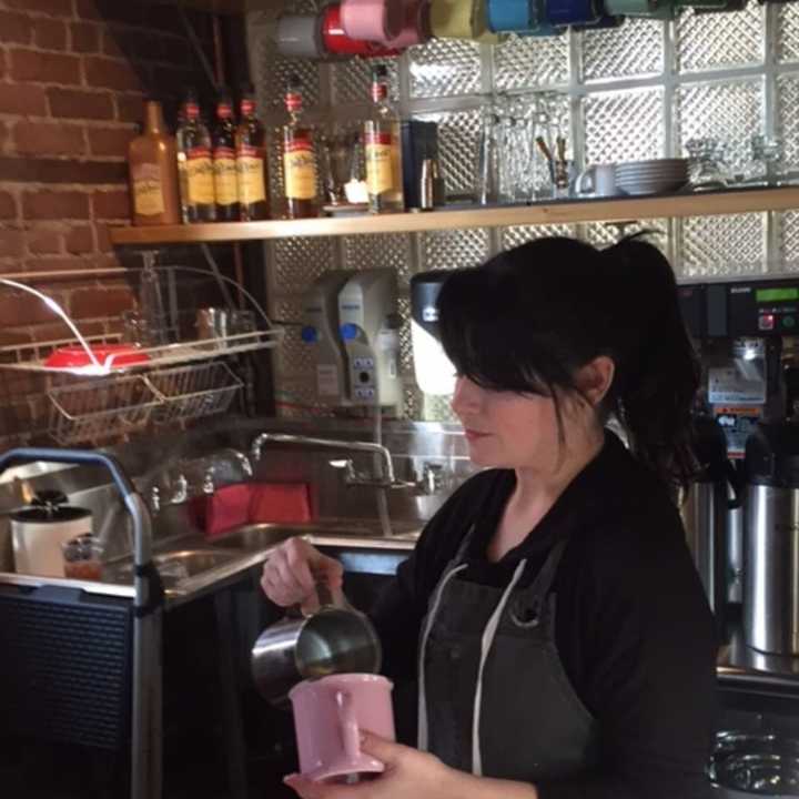 A barrista pours some brewed beans at Kurzhal&#x27;s Coffee, a cafe in the Peekskill Central Market on Main Street.