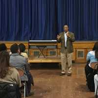 <p>Englewood on the Palisades Charter School hear from Assemblyman Gordon Johnson at a school assembly. </p>