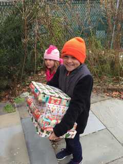 Holiday Donors Bring Joy To Astor Program Children, Families