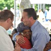 <p>Rob Astornio hugs one of the guests at the Westchester annual senior pool party/barbeque in White Plains.</p>