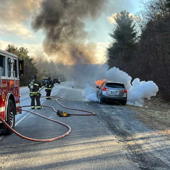 Firefighters were battling a car fire on I-395 in Auburn Tuesday afternoon, Jan. 31.