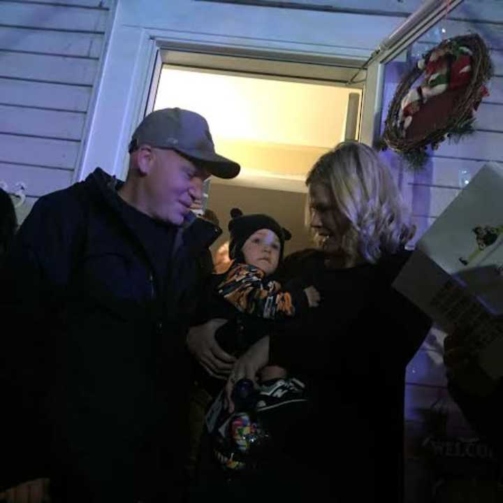 Tara and Ryan Walsh with baby Jackson for Fair Lawn&#x27;s &quot;Operation Santa Boone.&quot;