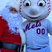 <p>Closter Police Officer Luis Ruiz was back as Santa -- here with the New York Metropolitans&#x27; mascot, Mr. Met.</p>