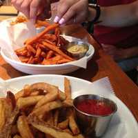 <p>Customers at The Barley House in Thornwood dig into a plate of sweet potato fries.</p>