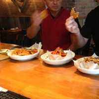 <p>Customers chow down on heaping plates of fries at The Barley House in Thornwood.</p>