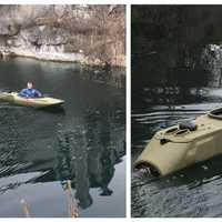 <p>Police use a special motorized kayak to recover the body of a dog who leapt into a Hamburg quarry Tuesday.</p>