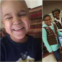 <p>Hackensack Girl Scouts and Daisies wrap gifts for Lil Ryu at the South Hackensack fire department.</p>