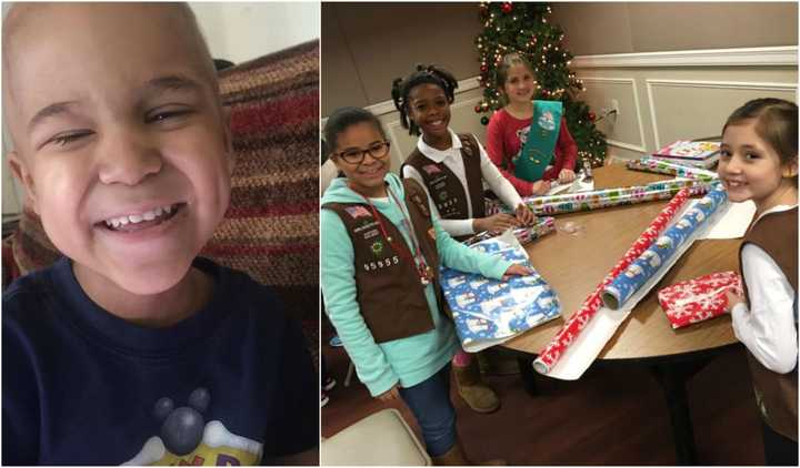 Hackensack Girl Scouts and Daisies wrap gifts for Lil Ryu at the South Hackensack fire department.