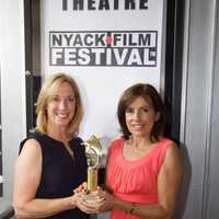 <p>Patti Panayotidis and Betsy Frano Feeney hold the People&#x27;s Choice award, which they received at the 2016 Nyack Film Festival.</p>