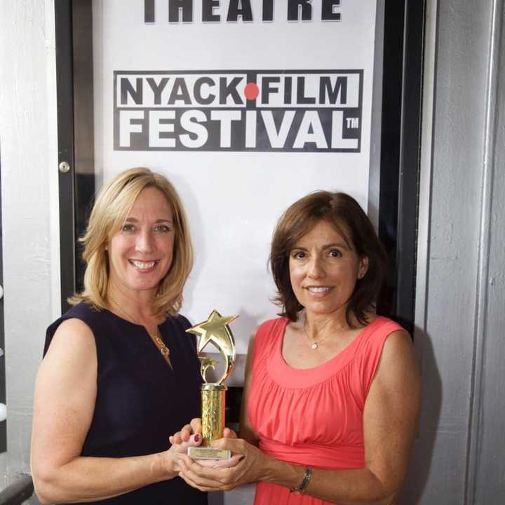 Patti Panayotidis and Betsy Frano Feeney hold the People&#x27;s Choice award, which they received at the 2016 Nyack Film Festival.