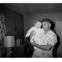 <p>Bill Griffeth as an infant being held by his dad, Charles Griffeth.</p>