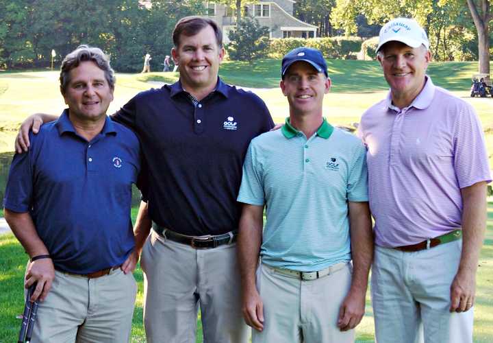 Rob Blosio of New Canaan, Roger Knick of Ridgefield, Dennis Hillman of Greenwich and Stepping Stones Museum for Children Board Member John S. Foster of Wilton are all smiles on the course at the Museum’s Swing Into It! Golf Tournament.