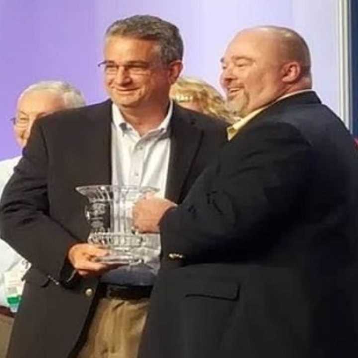 Paul Brennan, left, is presented with the Albert H. Hall Memorial Award by Jack Adger of the National Institute of Government Procurement. Brennan is Rockland County&#x27;s purchasing director.