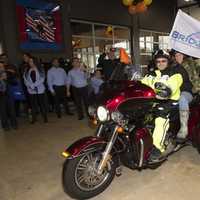 <p>A motorcade brought in the flag with the new logo for B.R.i.D.G.E.S., formerly Rockland Independent Living Center, to kick off the Roll It Out event on Oct. 22 at Harley-Davidson in Nanuet.</p>